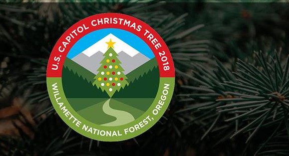 Event logo over tree branch.