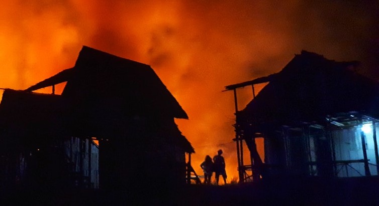 Photo of house burning.