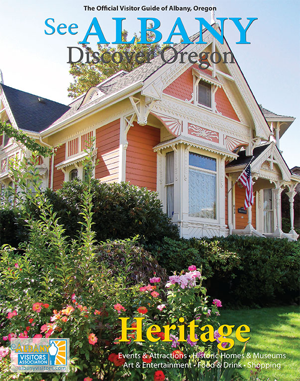 Photograph of the 2019/2020 Albany Visitors Guide magazine cover, featuring a historic home in Albany, Oregon