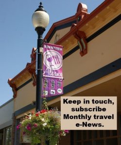Photo of banner on light post and word Subscribe.