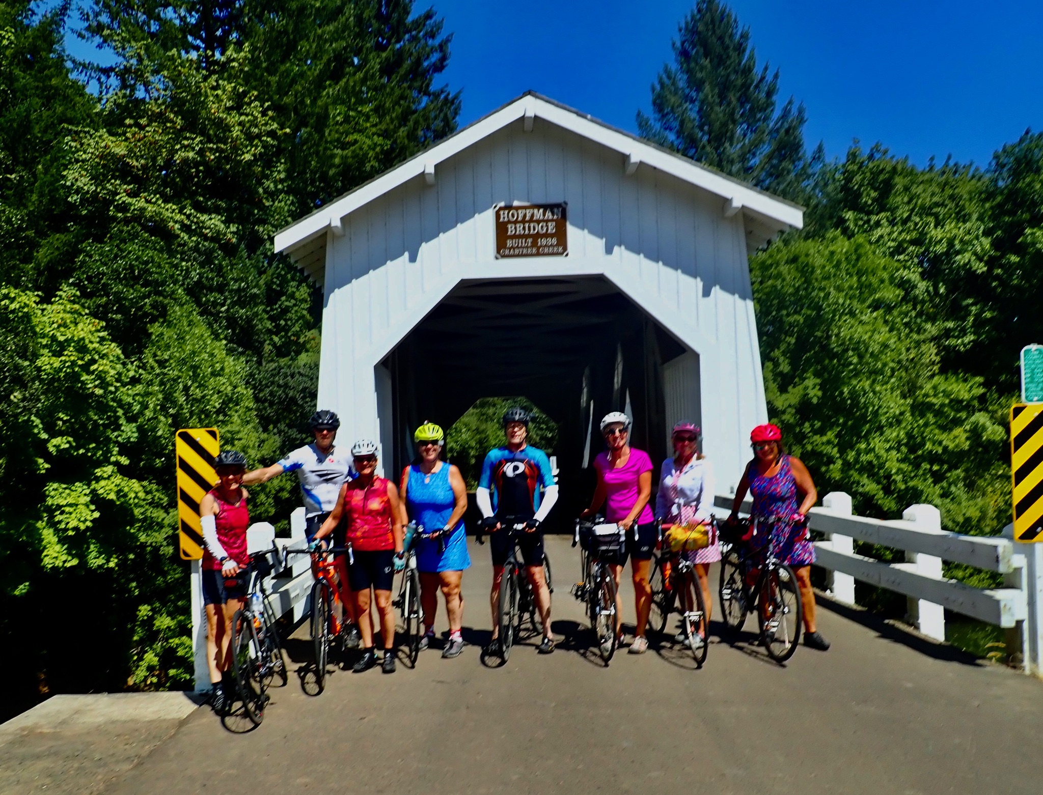 photo of bicycle riders on front of Hoffman Covered Bridge