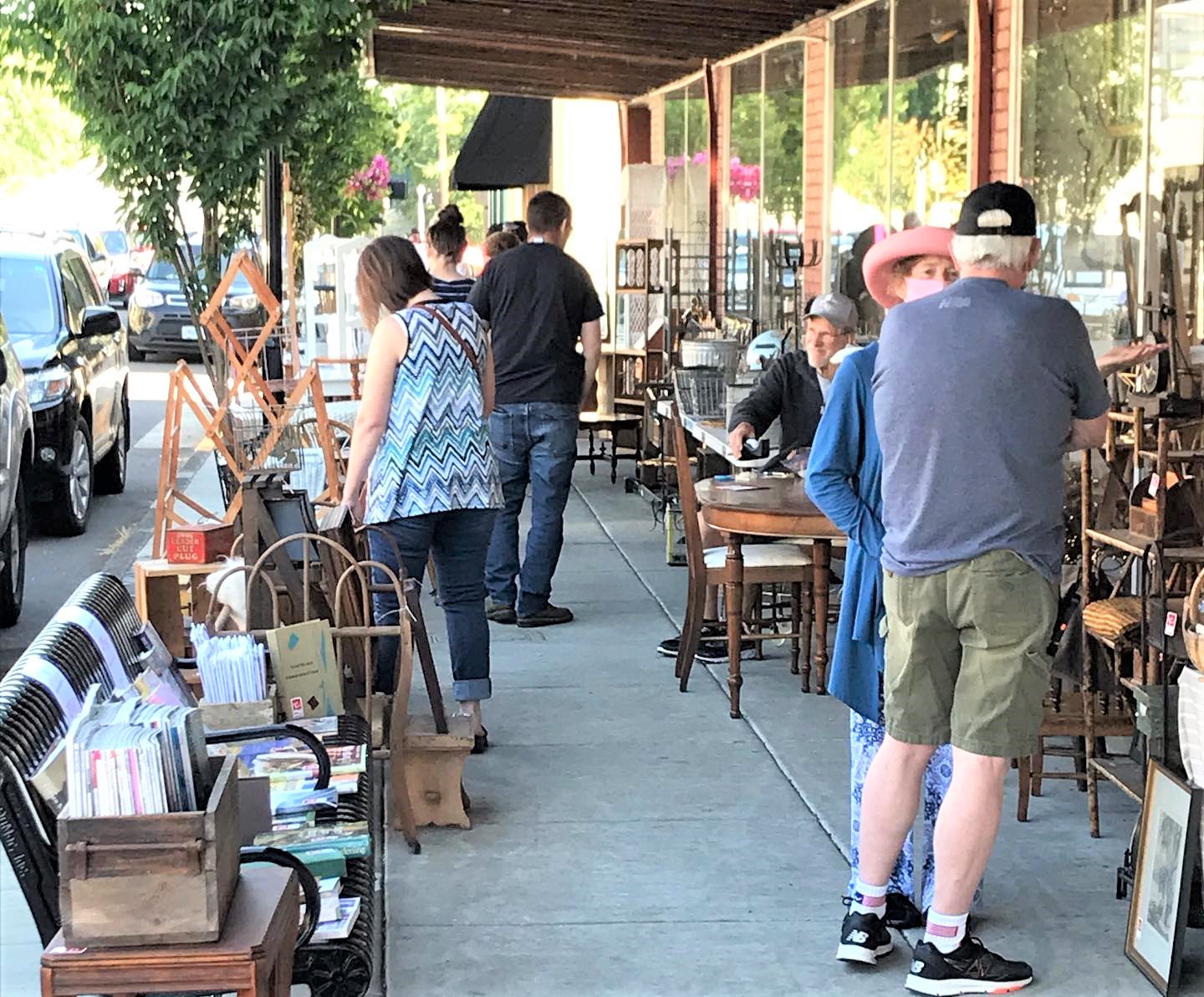 Photo of people shopping at sidewalk booths