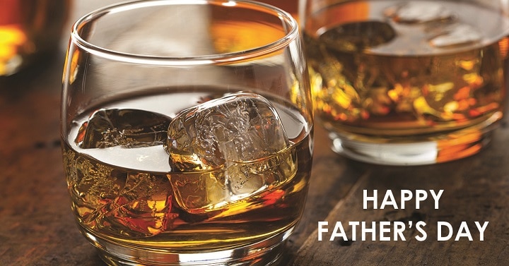 photo of whisky glasses with ice cubes