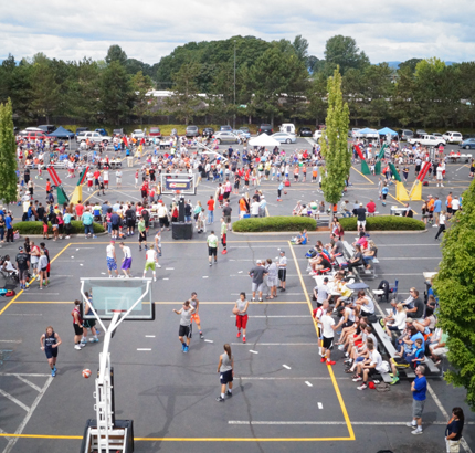 long view of crowded basketball courts