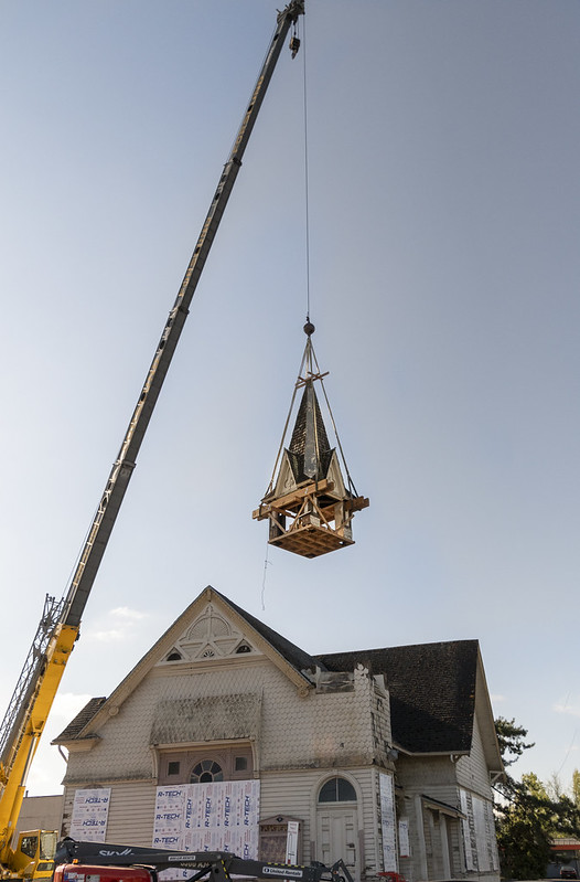 100 year old Cumberland building getting its steeple removed for renovation with a crane
