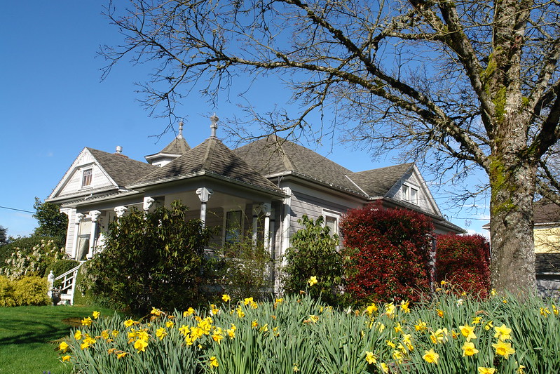 Historic Monteith House with daffodils blooming in front