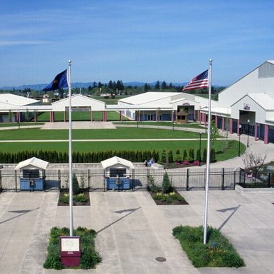 Ariel view of the front of the Linn County Expo Center with Oregon and US Flag