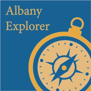 Albany Explorer Icon with a compass in gold and blue